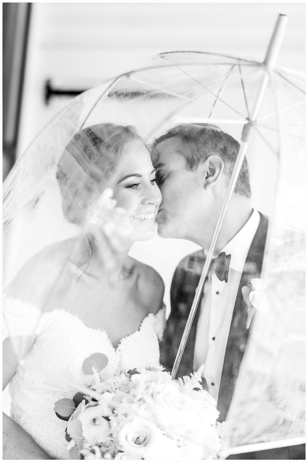 bride and groom portrait under umbrella at parker house spring lake nj