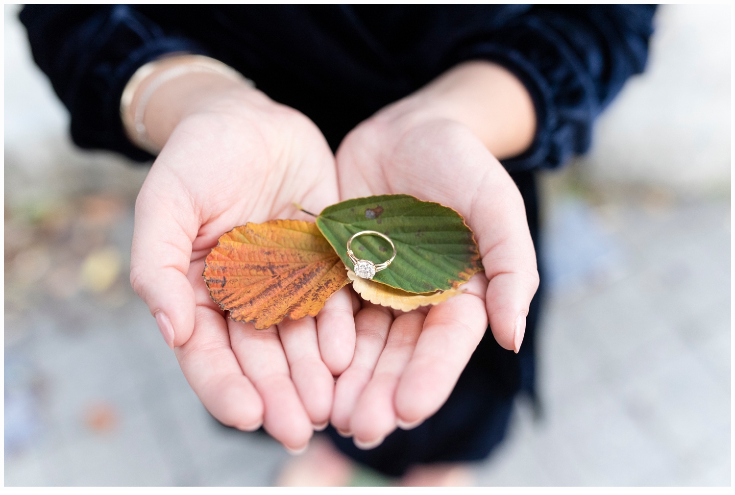pretty ring shot in hands with leaves