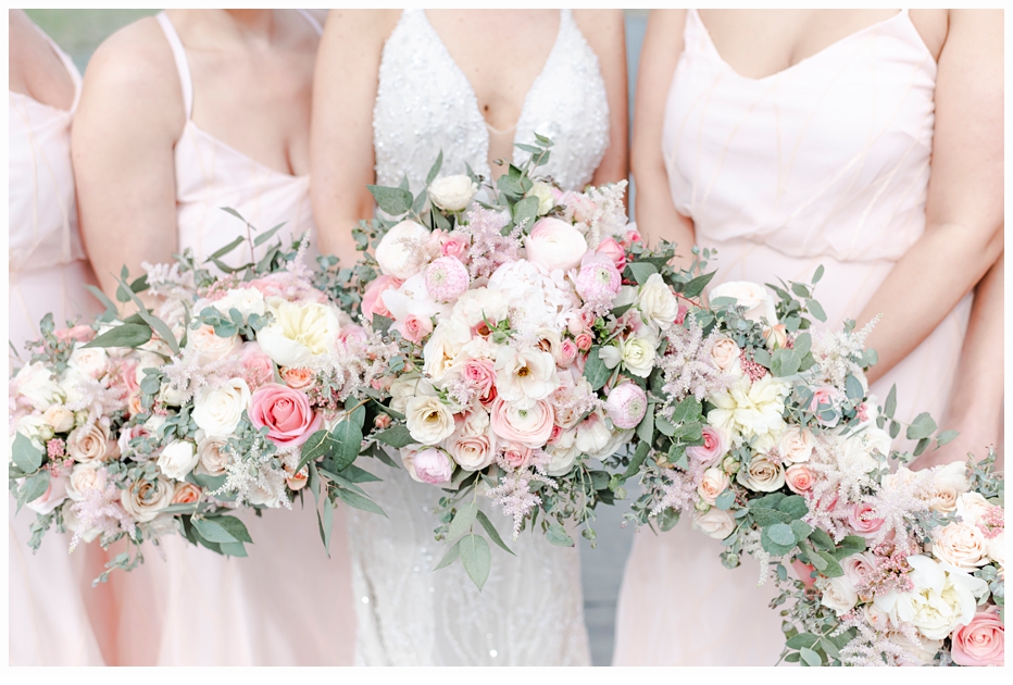 bridesmaids holding floral bouquets