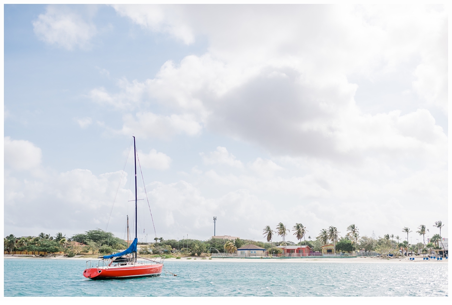 pretty red sailboat in aruba