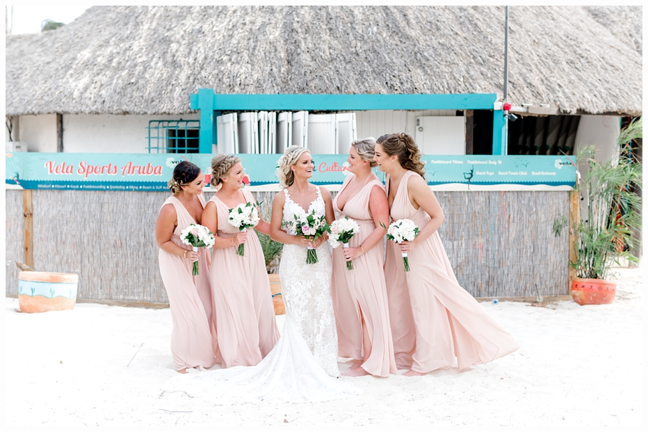 bride and bridesmaids on beach in aruba