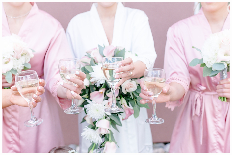 bride and bridemaid's toasting with champagne glasses 