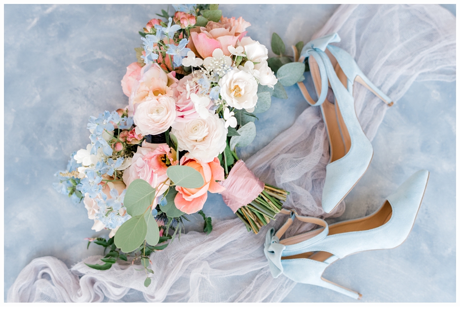 bridal bouquet and blue wedding shoes 