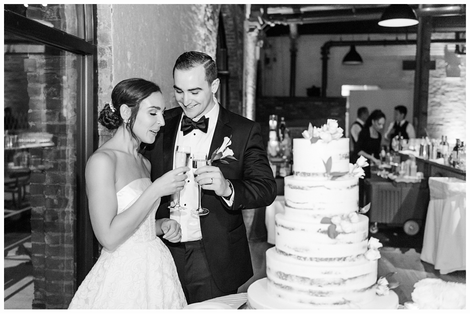 bride and groom eating wedding cake