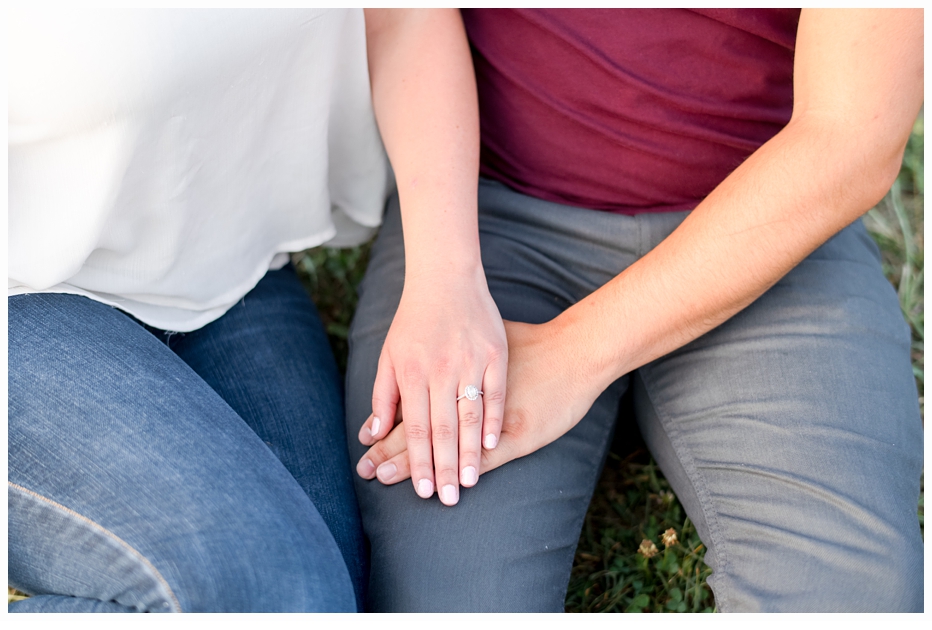 engaged couple holding hands