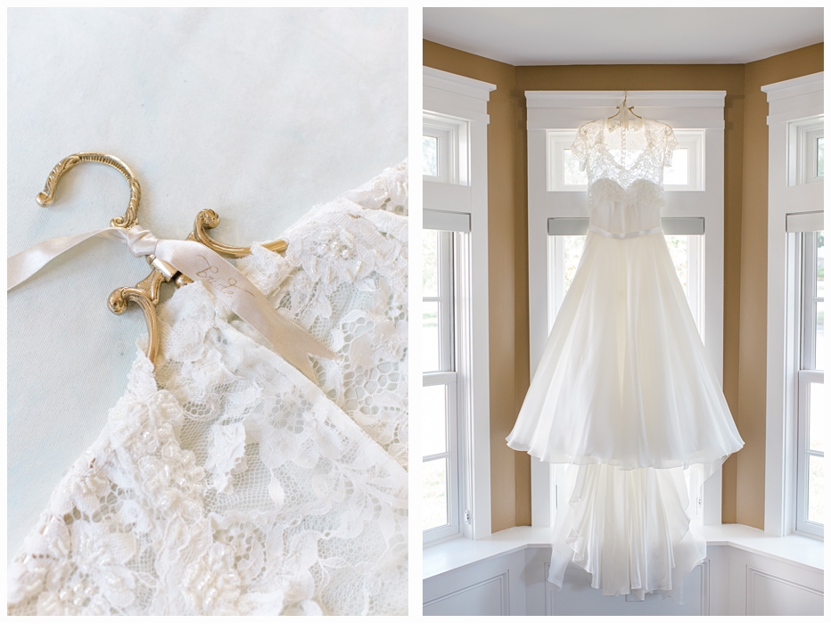 wedding gown on a gold hanger hanging in window