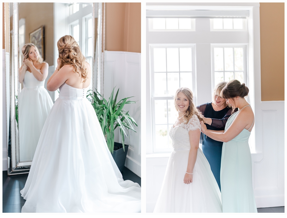 mom and maid of honor helping bride put on wedding gown