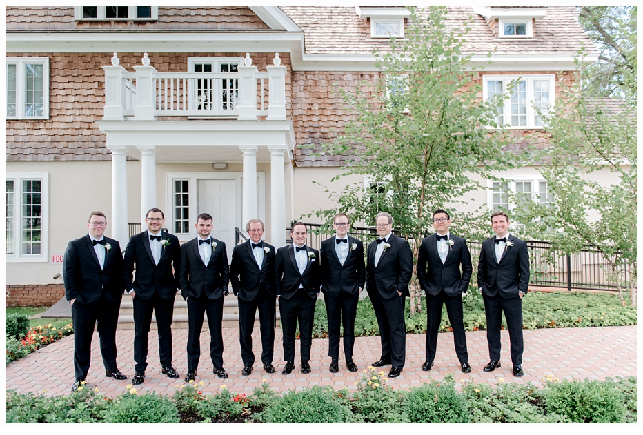 groom and groomsmen taking a photo