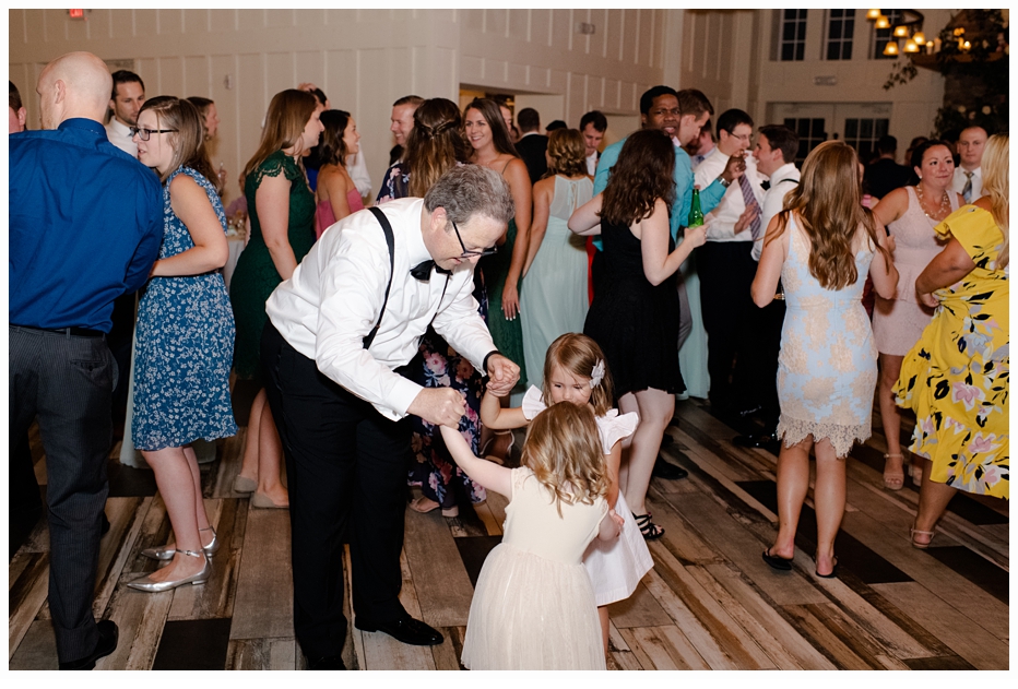 grandfather dancing with granddaughter at wedding