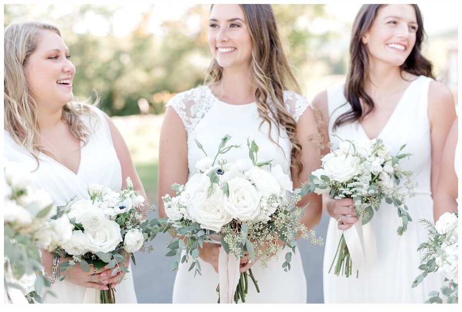 bride and bridesmaids carrying pretty bouquets