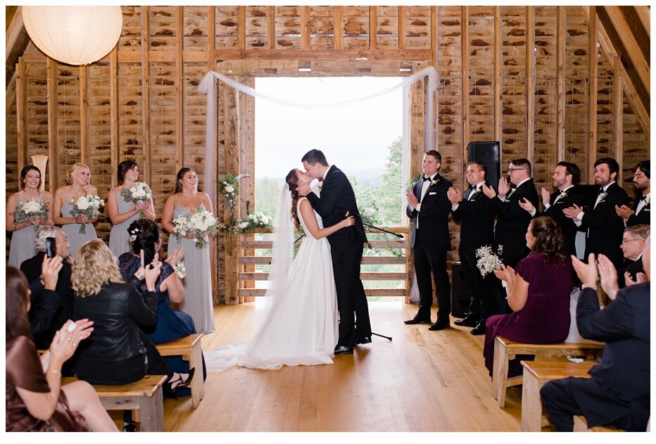 bride and groom kissing at ceremony