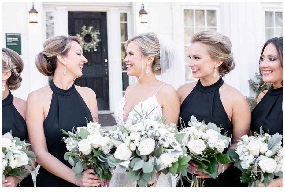 bride and bridesmaids laughing together