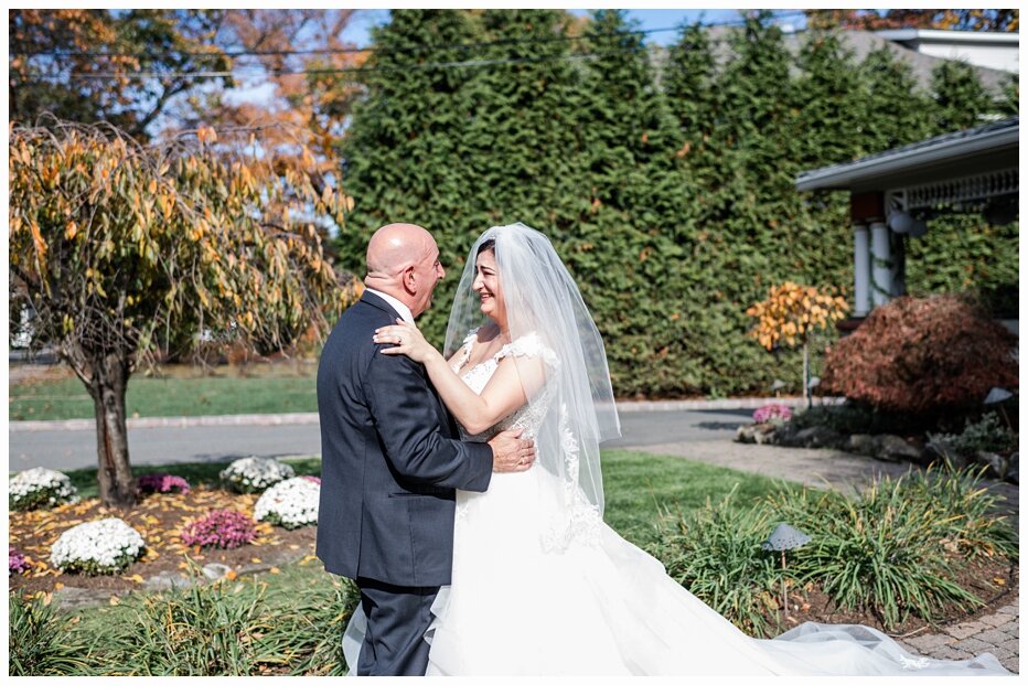 bride and dad seeing each other on wedding day