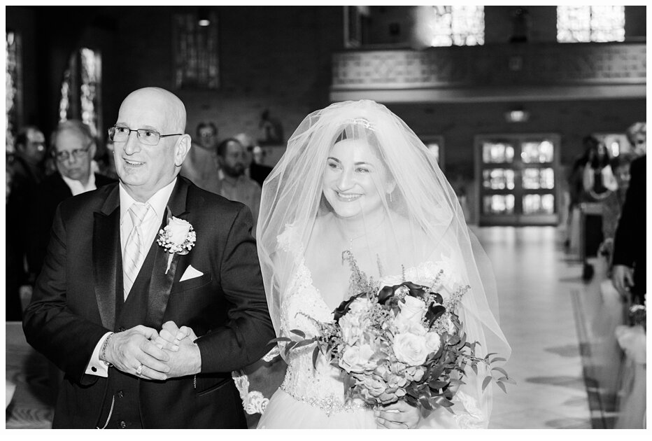 father walking daughter down the aisle at wedding