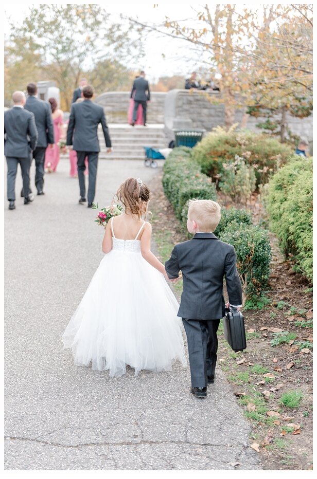 flower girl and ring bearer holding hands