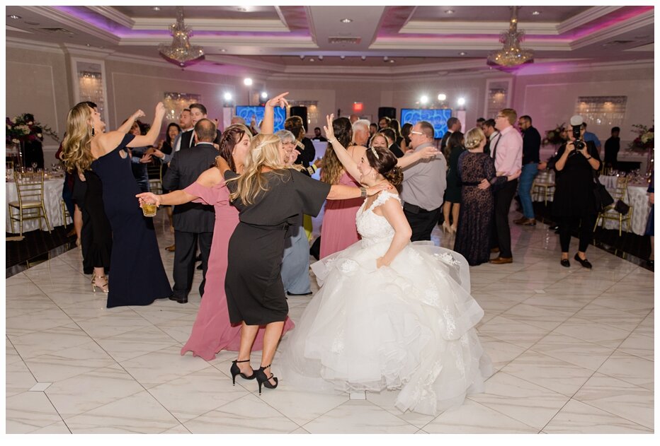 bride dancing with friends