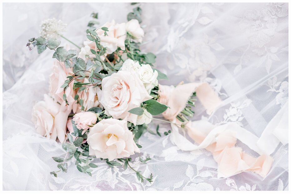 pretty bridal bouquet sitting on a veil