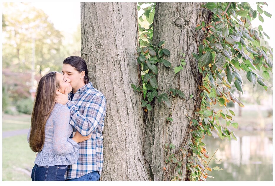 engaged couple kissing