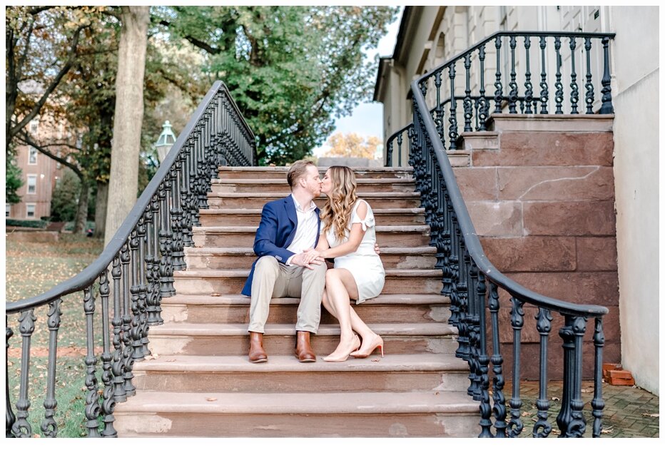 engaged couple kissing on a pretty staircase