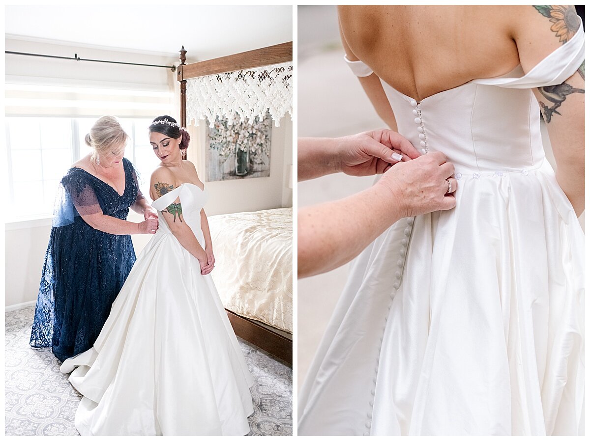 mom helping daughter into her wedding gown