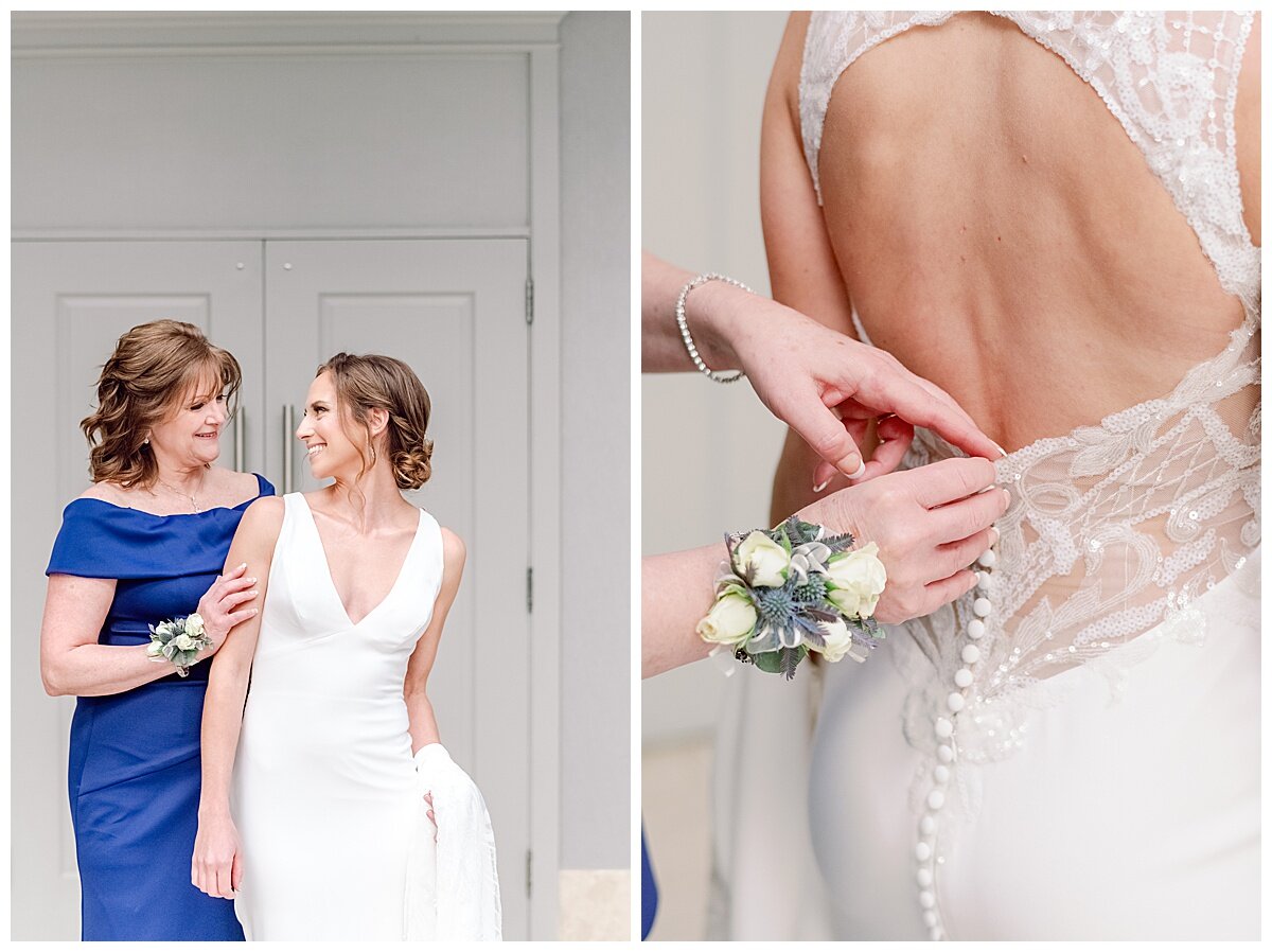 mother of bride helping bride into her wedding gown