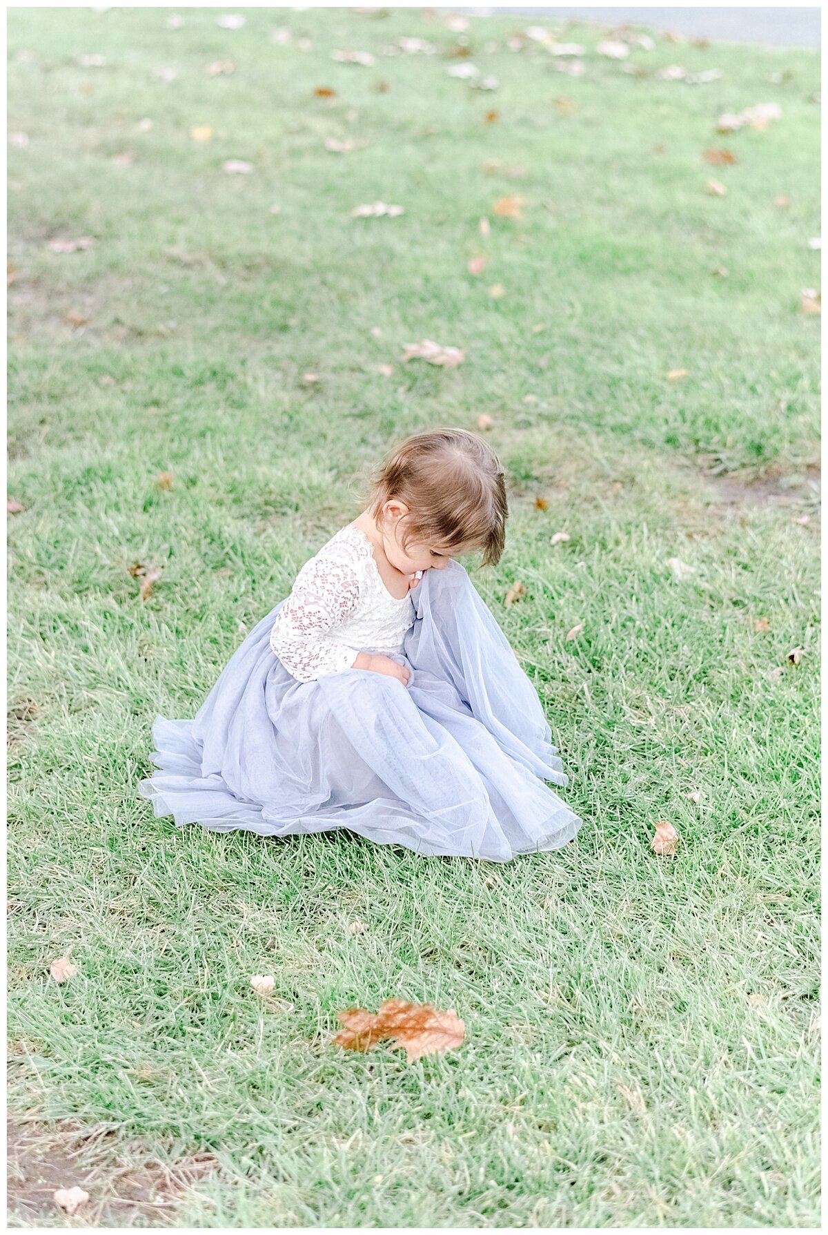 flower girl playing in the grass