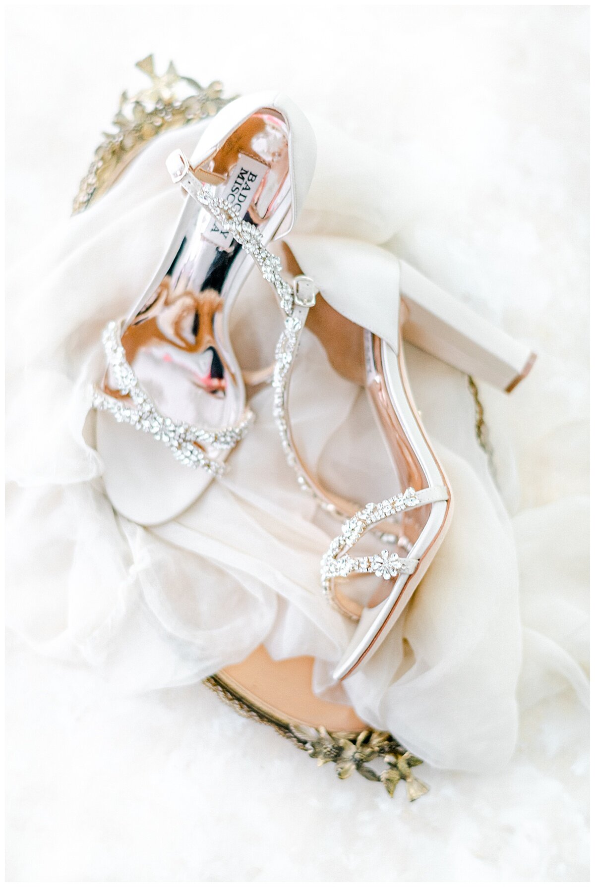 white wedding shoes on a gold tray