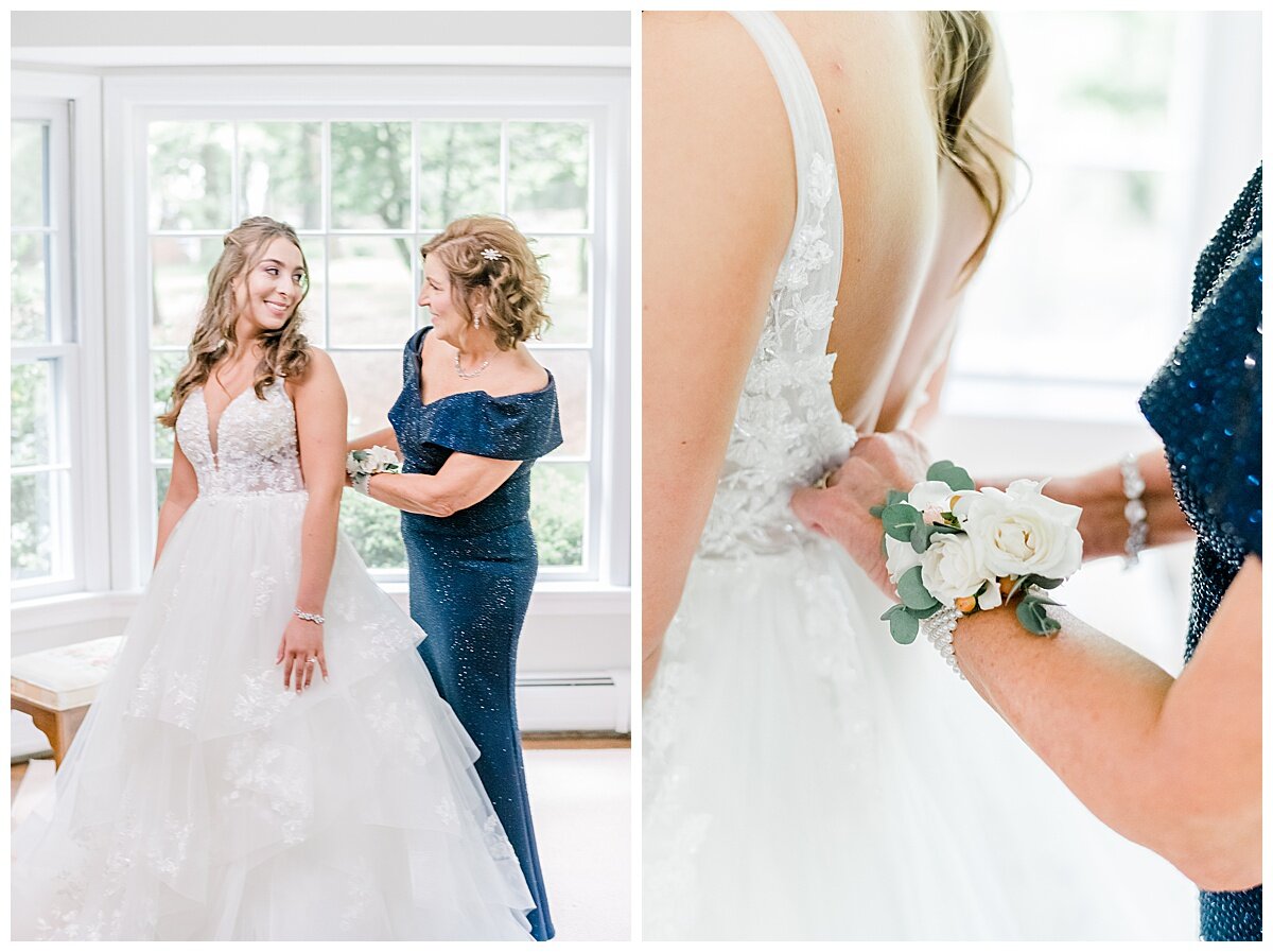 mom helping bride in her wedding gown