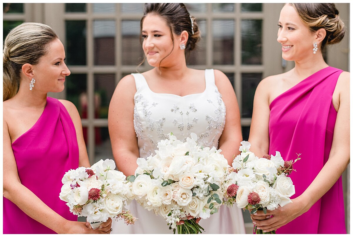 bride and bridesmaids holding pretty bouquets.
