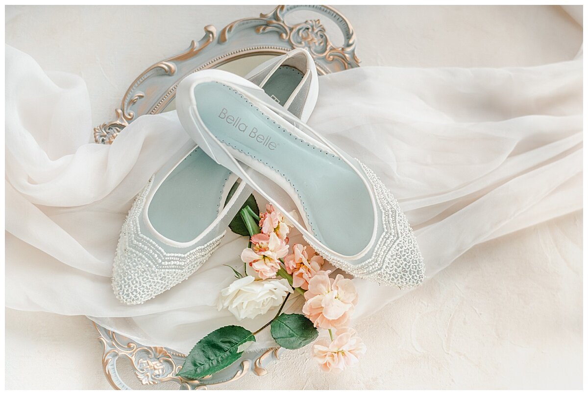 pretty bella belle wedding shoes on a gold tray