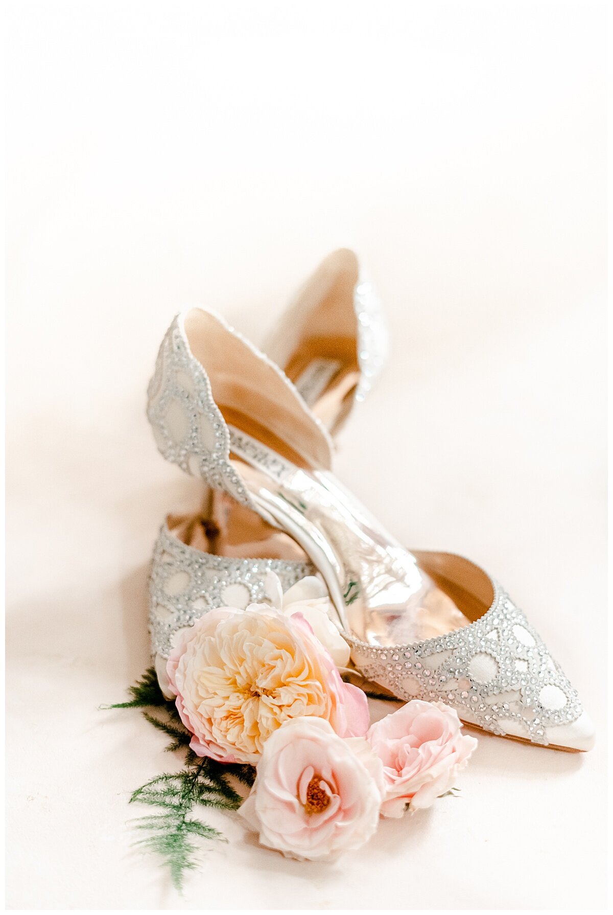 bridal shoes surrounded by pretty flowers