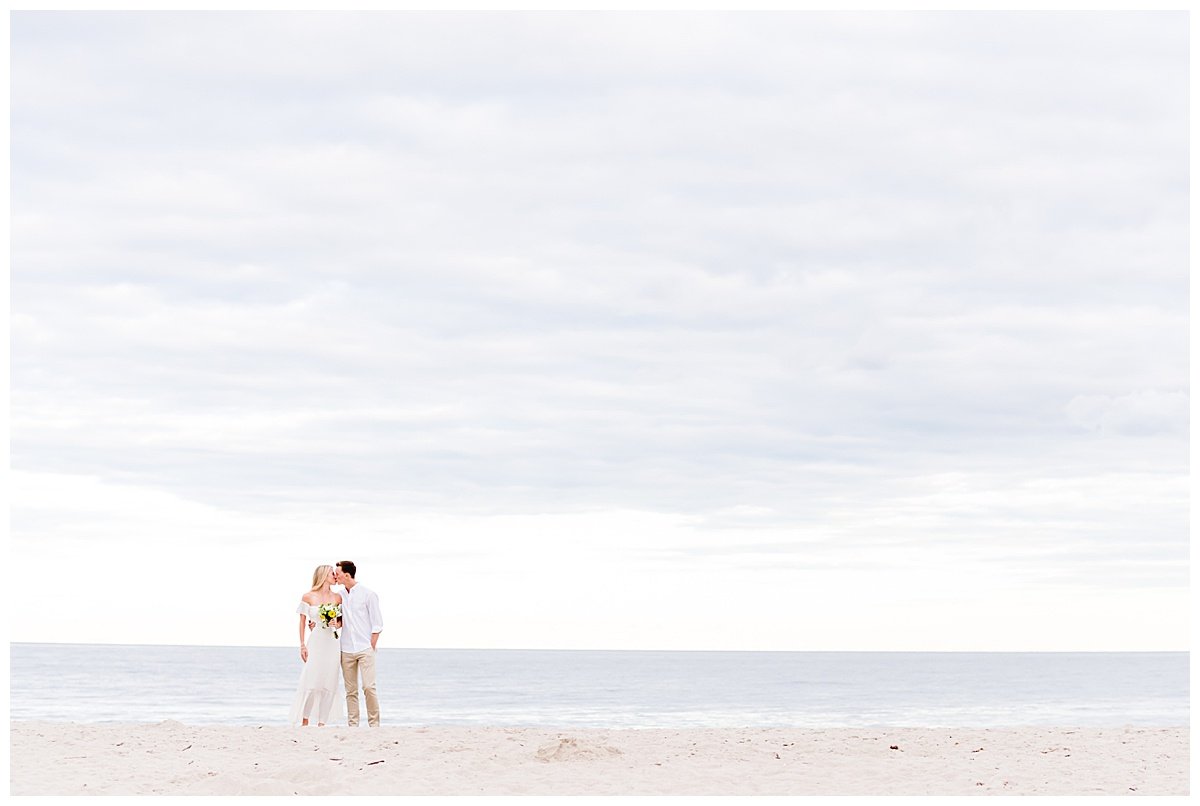 engaged couple on the beach