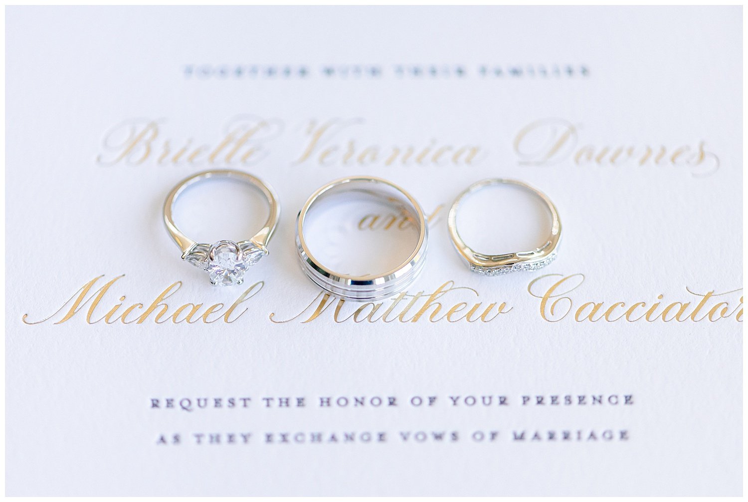 wedding rings on an invitation