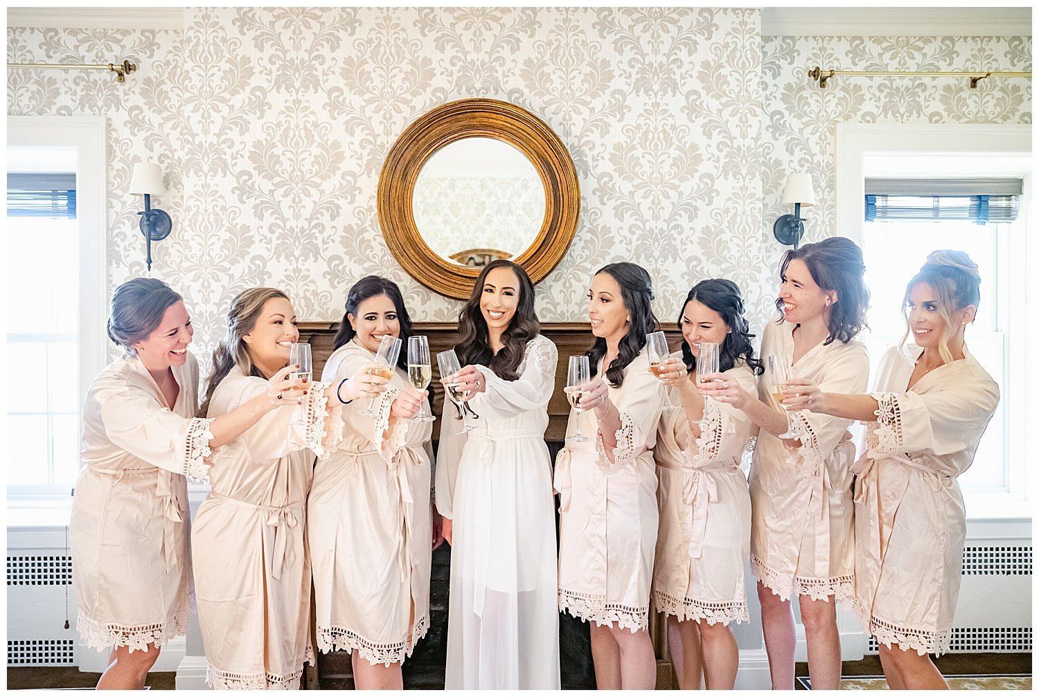 bride and bridesmaids having a champagne toast in bridal suite