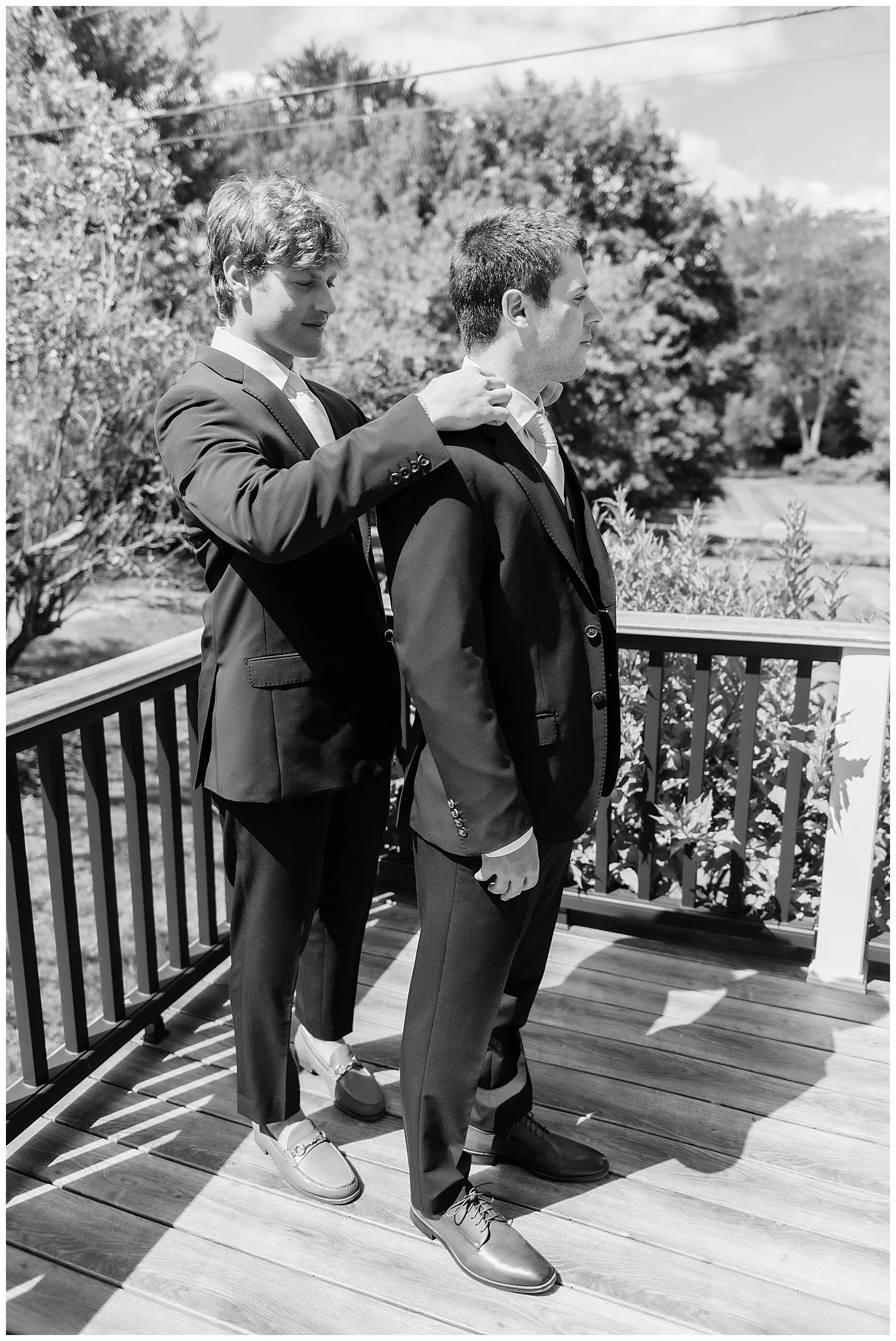 best man and groom getting ready