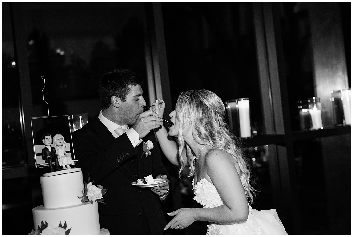 bride and groom cutting wedding cake