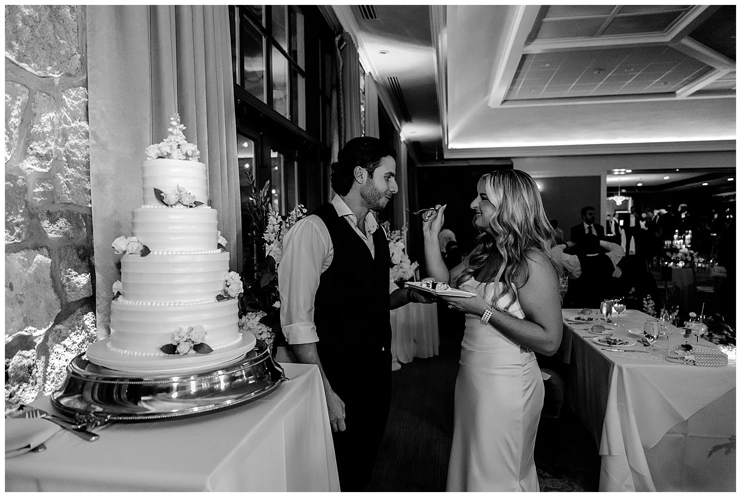 bride and groom cutting wedding cake