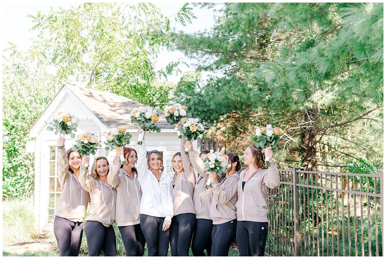 bride and bridesmaids doing a cheer