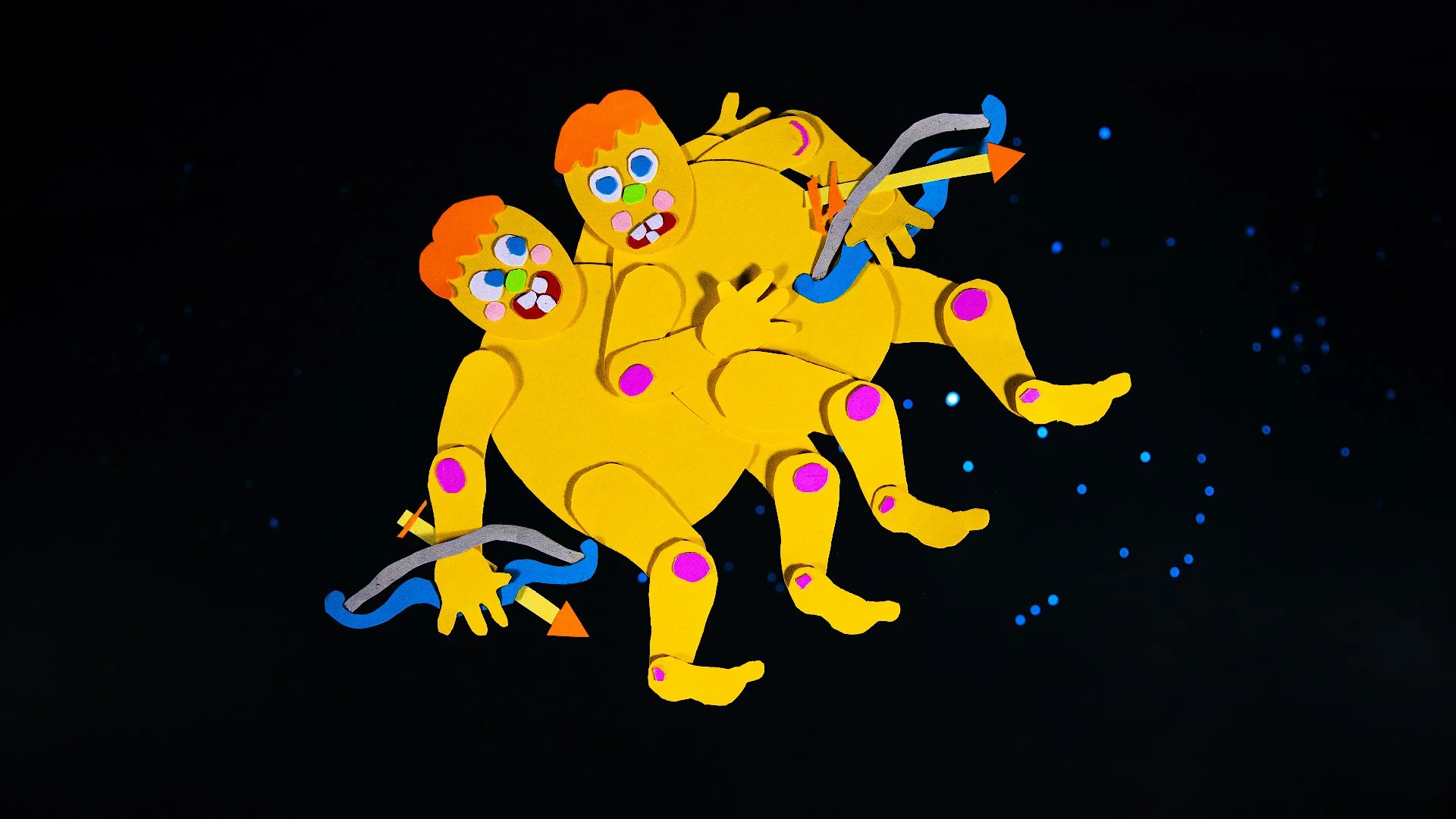 Cartoon illustration of two bright yellow monkeys with orange hair and colorful facial features, floating in space against a dark background with small blue stars, holding a double helix structure.