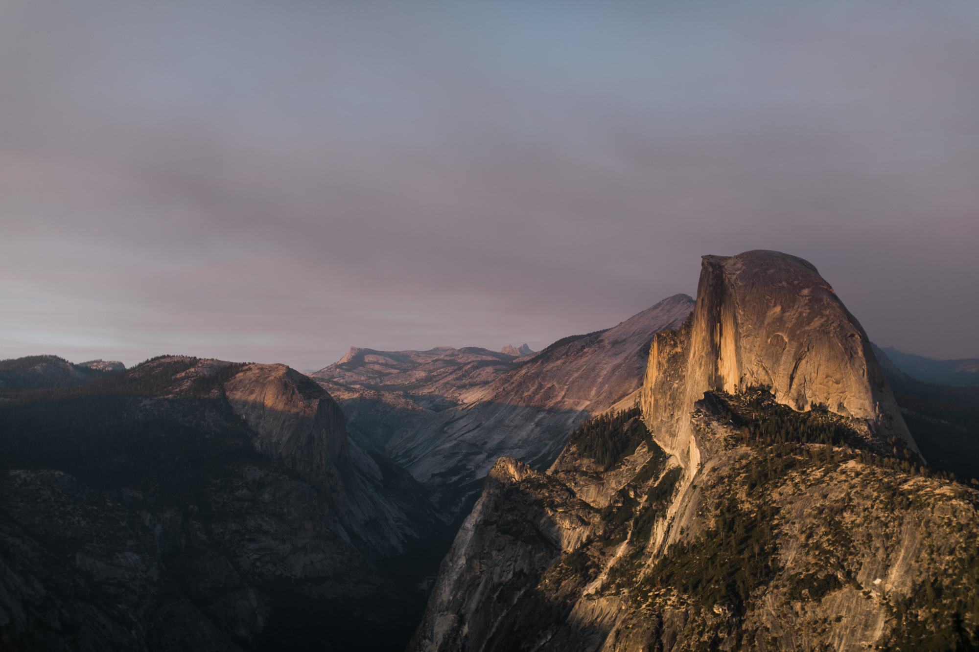 dreema + jay's adventurous engagement session + surprise proposal | yosemite valley + glacier point, yosemite national park | destination elopement photographer | www.thehearnes.com