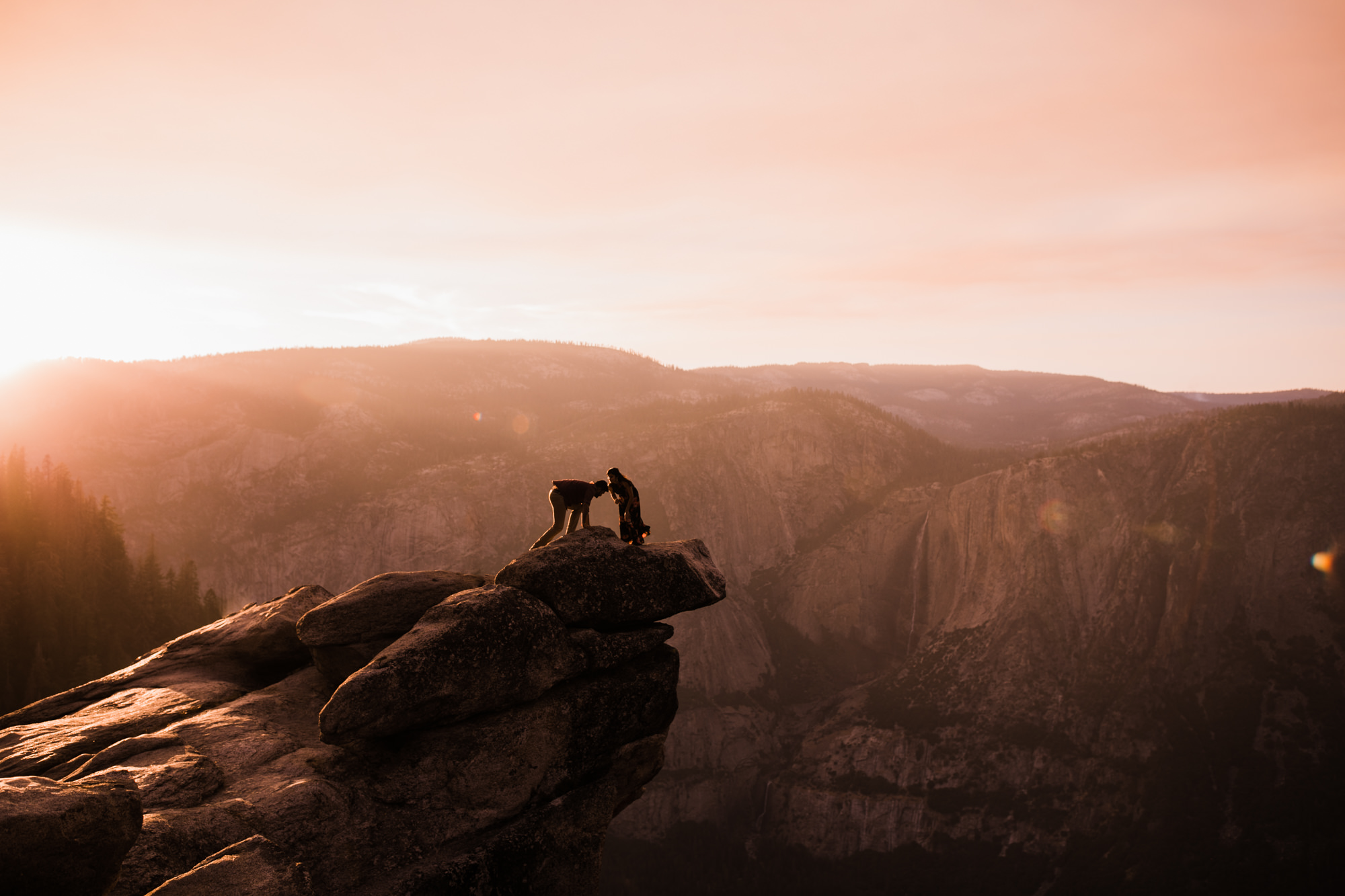 dreema + jay's adventurous engagement session + surprise proposal | yosemite valley + glacier point, yosemite national park | destination elopement photographer | www.thehearnes.com