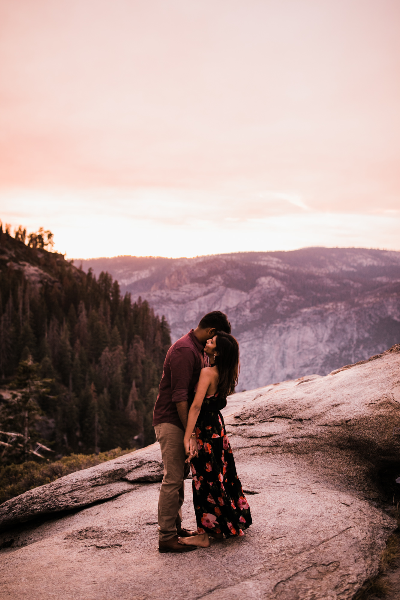 dreema + jay's adventurous engagement session + surprise proposal | yosemite valley + glacier point, yosemite national park | destination elopement photographer | www.thehearnes.com