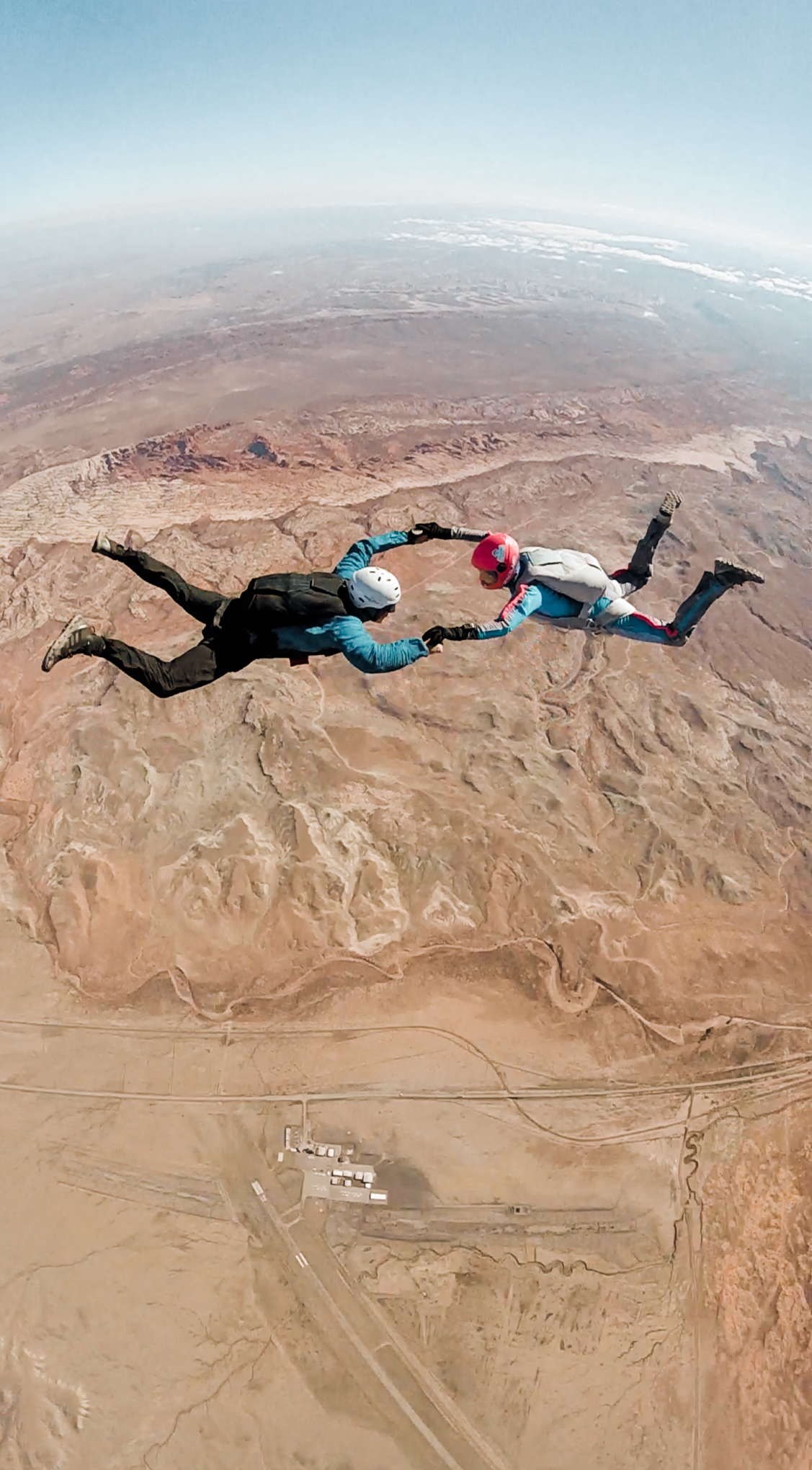 wedding photographers enjoying an off day skydiving over arches national park and canyonlands national park in moab