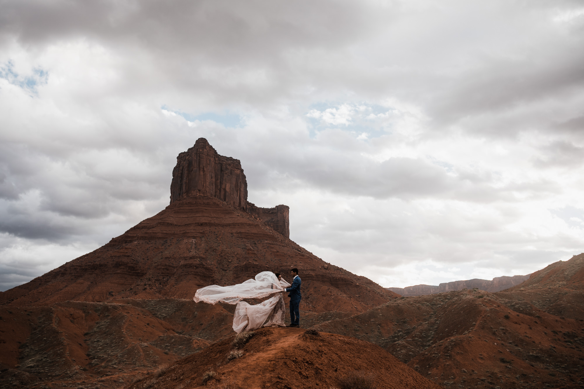 first look bridal session in the moab desert | adventurous utah elopement | lily rose by galia lahav | utah spacenet wedding | the hearnes adventure photography | www.thehearnes.com