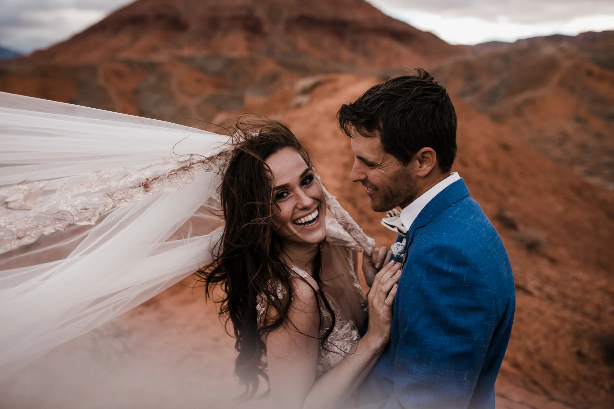 first look bridal session in the moab desert | adventurous utah elopement | lily rose by galia lahav | utah spacenet wedding | the hearnes adventure photography | www.thehearnes.com