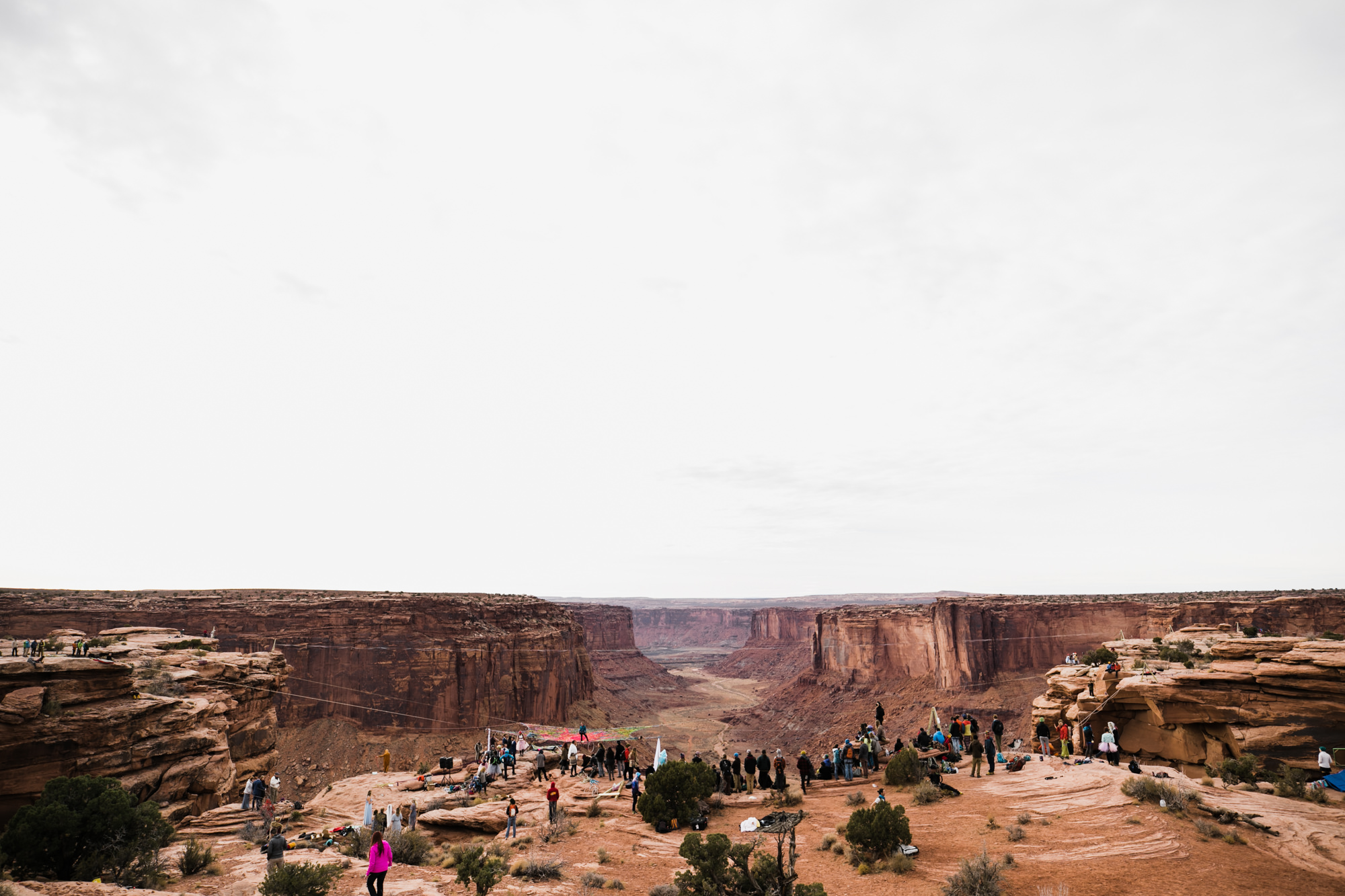 spacenet wedding 400 feet above a canyon in moab, utah | adventurous desert elopement | galia lahav bride | the hearnes adventure wedding photography | www.thehearnes.com