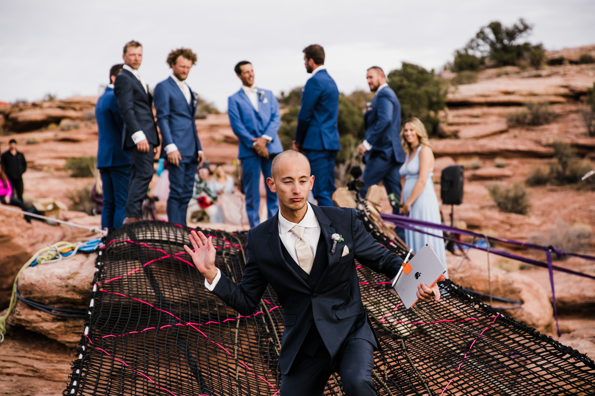 spacenet wedding 400 feet above a canyon in moab, utah | adventurous desert elopement | galia lahav bride | the hearnes adventure wedding photography | www.thehearnes.com