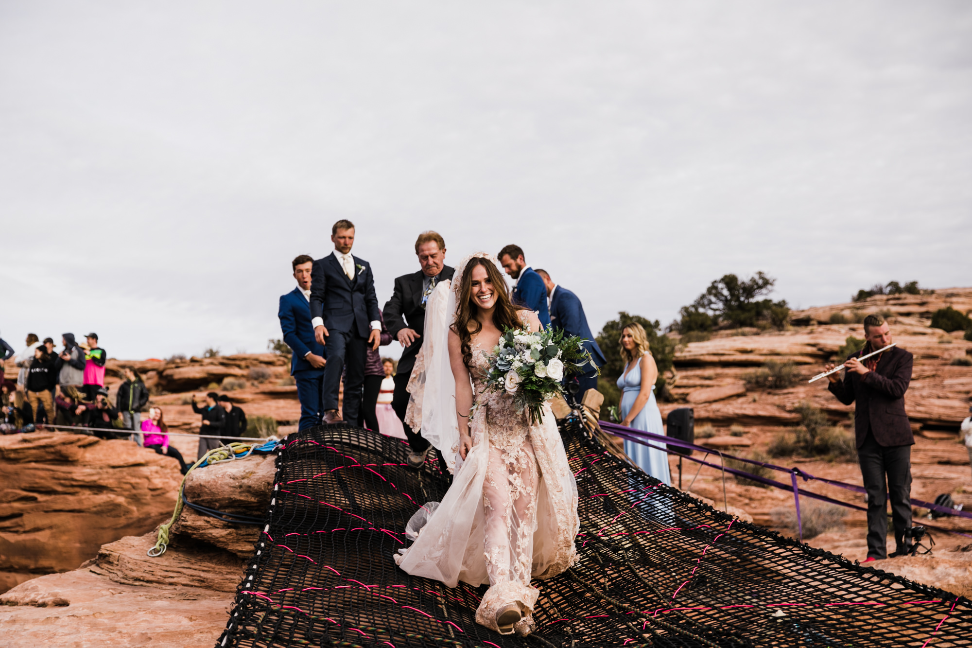 spacenet wedding 400 feet above a canyon in moab, utah | adventurous desert elopement | galia lahav bride | the hearnes adventure wedding photography | www.thehearnes.com