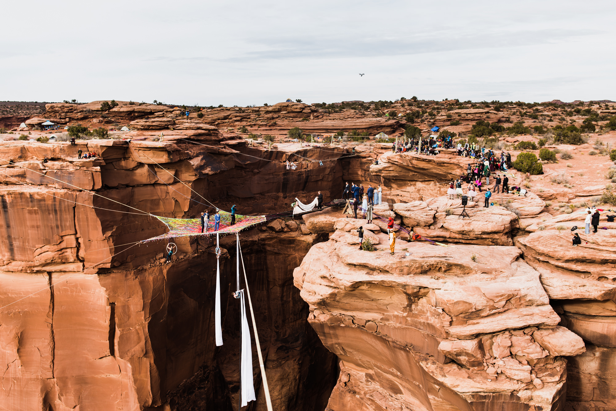 spacenet wedding 400 feet above a canyon in moab, utah | adventurous desert elopement | galia lahav bride | the hearnes adventure wedding photography | www.thehearnes.com