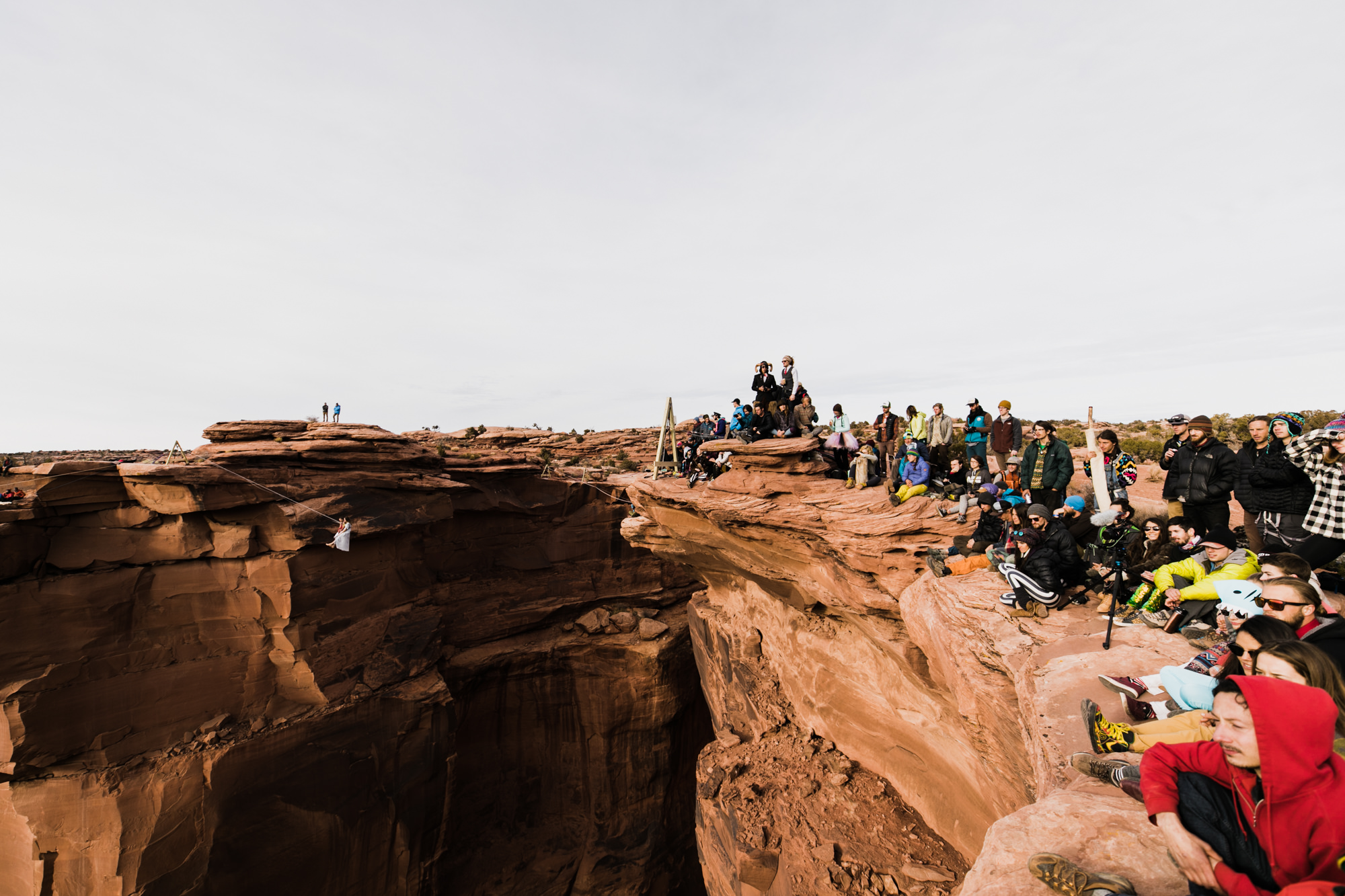 spacenet wedding 400 feet above a canyon in moab, utah | adventurous desert elopement | galia lahav bride | the hearnes adventure wedding photography | www.thehearnes.com